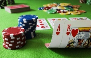7005252-chips-and-ace-king-hand-on-a-gambling-table